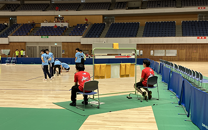 Employees updating the scoreboard